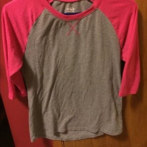 A baseball tee very comfortable,Fits like a medium